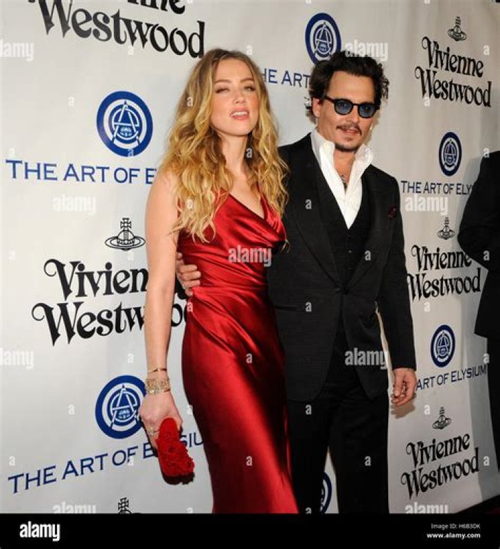 Actors Amber Heard (L) and Johnny Depp attend the "Black Mass" premiere during the 2015 Toronto International Film Festival at The Elgin on Septemb...