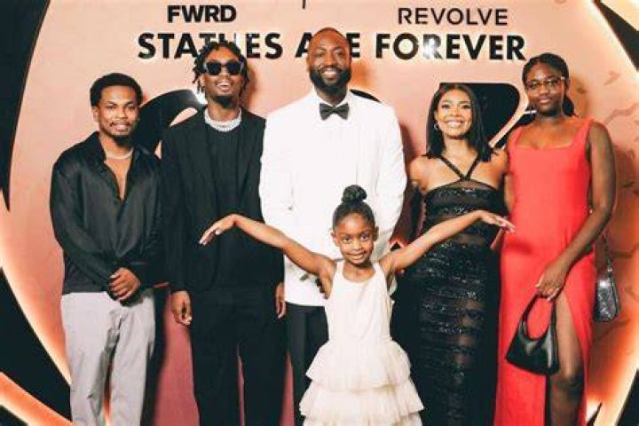 Dwyane with kids in a charity event