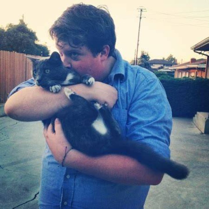 Jacob Wysocki spending quality time with his cat.