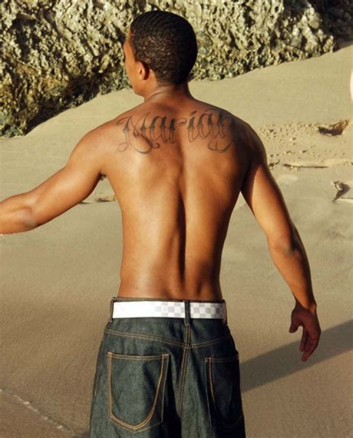 Nick Cannon covers tattoo