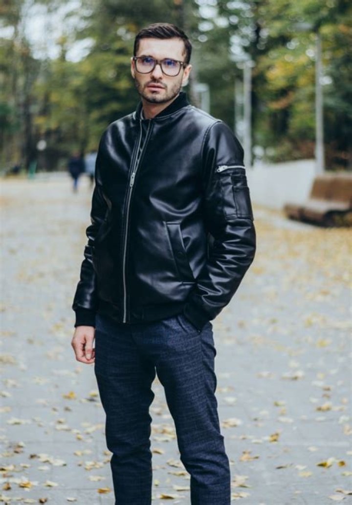 Richardson wearing black leather jacket and wearing golden earrings.