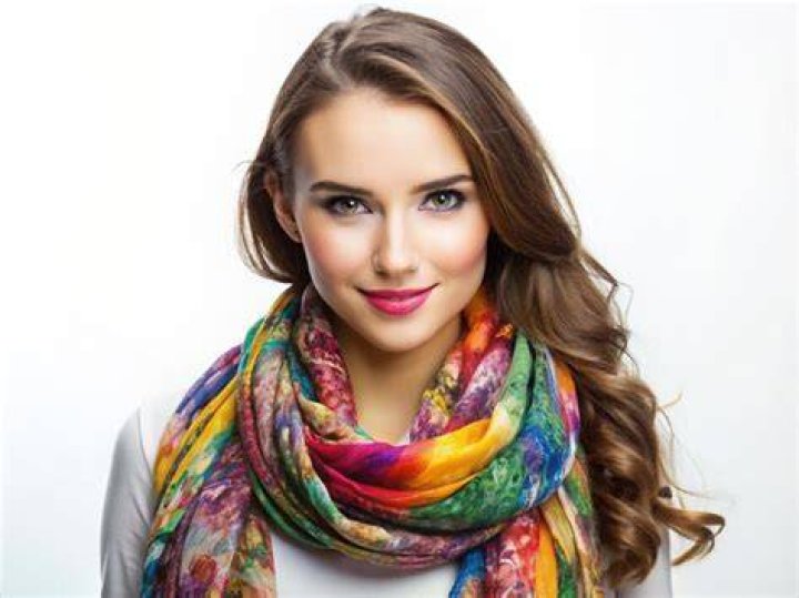 She is wearing a colorful hat in the selfie.