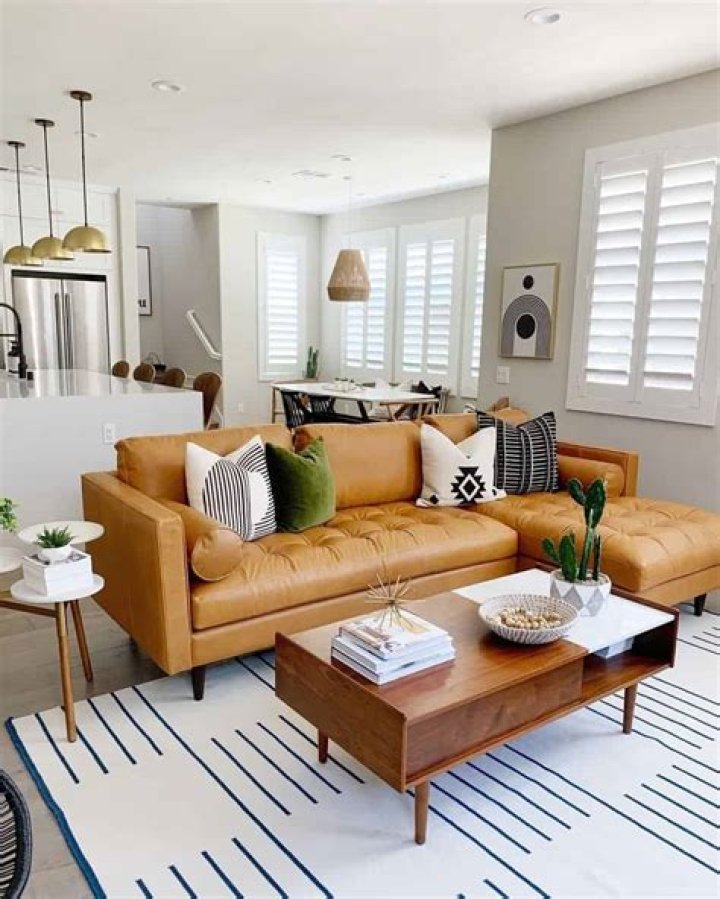 What color goes with caramel sofa?