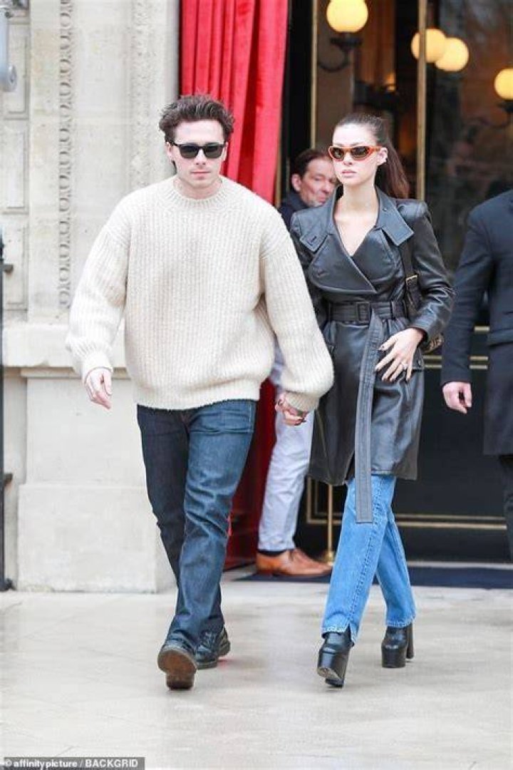 Will Peltz in his coat and Nicola Peltz in her crop top